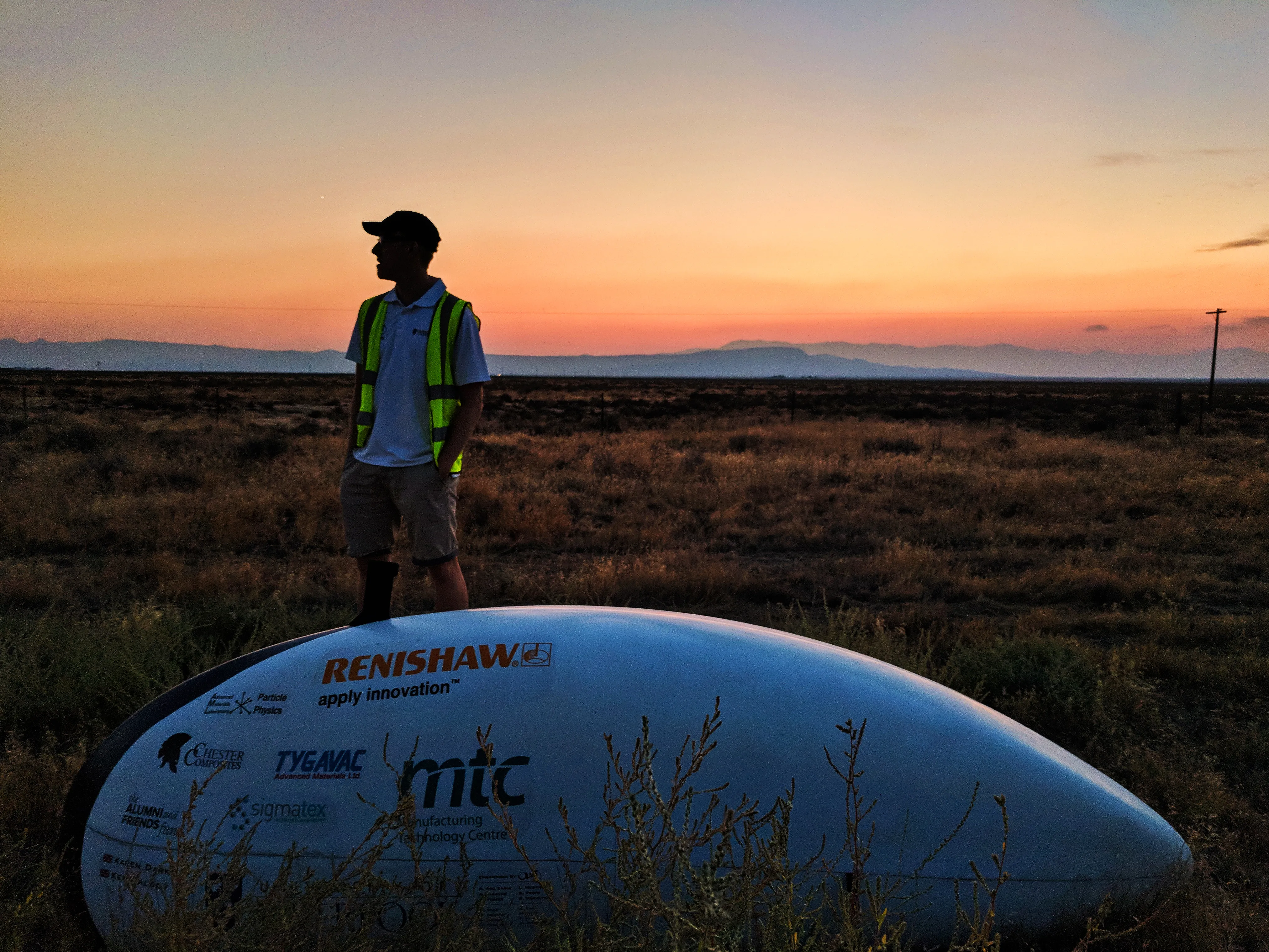 A figure in hi-vis waiting for ARION4 to be picked up after a crash